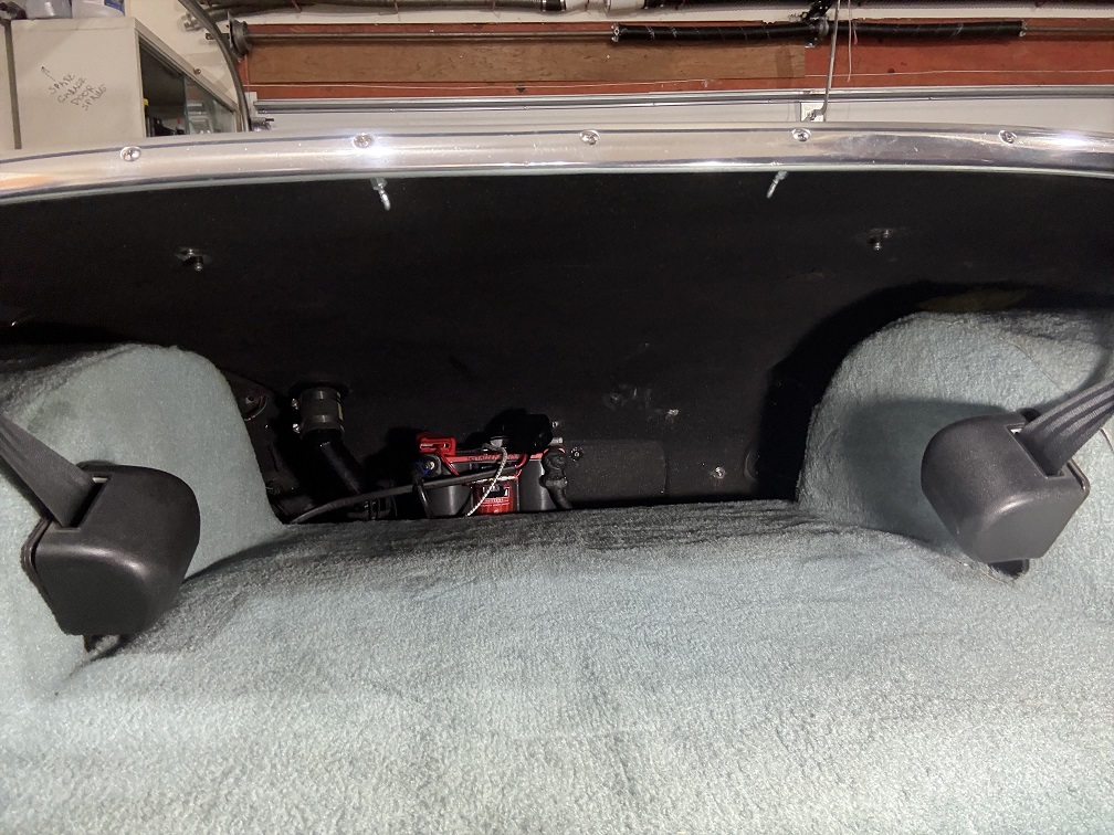 Finished trunk containing well-secured battery.